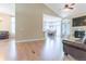 Open living space with hardwood floors, a fireplace, and seamless flow to the dining area at 19249 E Progress Ave, Centennial, CO 80015