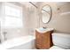 Cozy bathroom featuring a tub and shower combination with an oval mirror above the sink at 2856 Jasmine St, Denver, CO 80207
