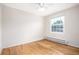 Bright bedroom with hardwood floors, a window, and ceiling fan providing natural light at 2856 Jasmine St, Denver, CO 80207