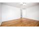 Sunlit bedroom showcasing hardwood floors and an open doorway providing a bright and airy feel at 2856 Jasmine St, Denver, CO 80207