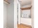 Well-lit closet features an air conditioner and wood shelf, optimizing storage space at 2856 Jasmine St, Denver, CO 80207