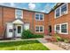 Brick building with well-kept landscaping, showcasing the multiple units and inviting curb appeal at 2856 Jasmine St, Denver, CO 80207