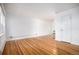Spacious living room with hardwood floors, neutral walls, and ample natural light from the window at 2856 Jasmine St, Denver, CO 80207