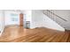 Inviting living area featuring hardwood floors, a staircase, and ample room for furnishings at 2856 Jasmine St, Denver, CO 80207