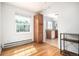 Hardwood floors connect the living room to a well-lit kitchen area in this updated apartment at 2856 Jasmine St, Denver, CO 80207