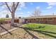 Spacious backyard features a shed, patio, and well-maintained lawn at 5432 E Bails Dr, Denver, CO 80222