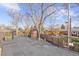 Balcony overlooking a backyard featuring a shed, garden, and fenced perimeter at 5432 E Bails Dr, Denver, CO 80222