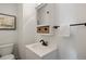 Bathroom with a mirror cabinet, towel rack, and vanity at 5432 E Bails Dr, Denver, CO 80222