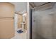 Basement full bathroom features shower, pedestal sink and storage at 5432 E Bails Dr, Denver, CO 80222
