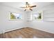 Bedroom with hardwood floors and built-in bookshelves at 5432 E Bails Dr, Denver, CO 80222