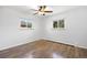 Empty bedroom with hard wood floors, and two windows at 5432 E Bails Dr, Denver, CO 80222