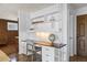 Built-in desk features overhead lights and multiple drawers in this beautifully designed office area at 5432 E Bails Dr, Denver, CO 80222
