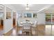 Bright dining room featuring wood floors, natural light, and view to the exterior at 5432 E Bails Dr, Denver, CO 80222