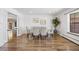 Dining room featuring wood floors, sliding doors, and a large window at 5432 E Bails Dr, Denver, CO 80222