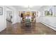 Dining room featuring wood floors, sliding doors, and a view into the kitchen at 5432 E Bails Dr, Denver, CO 80222