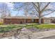 Charming brick ranch-style home with a well-maintained lawn and mature trees at 5432 E Bails Dr, Denver, CO 80222