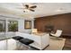 Cozy living room with exposed brick fireplace and sliding glass doors leading to the outdoors at 5432 E Bails Dr, Denver, CO 80222