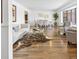 Bright living room with hardwood floors, modern furnishings, and a large bay window at 5432 E Bails Dr, Denver, CO 80222
