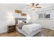 Bedroom with hardwood floors, ceiling fan, and natural light from the window at 5432 E Bails Dr, Denver, CO 80222