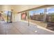 Tile patio area with a ladder and back yard view with a garden and a barn at 5432 E Bails Dr, Denver, CO 80222