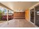 Covered patio featuring brick and wood accents with a view of a charming backyard shed at 5432 E Bails Dr, Denver, CO 80222