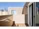 Balcony with wooden floors overlooking the property and adjacent homes at 9605 E Kansas Cir # 55, Denver, CO 80247