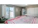 Light-filled bedroom with a private balcony, closet, and tranquil atmosphere for restful nights at 9605 E Kansas Cir # 55, Denver, CO 80247