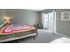 This bedroom features a sliding glass door that provides access to a private balcony at 9605 E Kansas Cir # 55, Denver, CO 80247