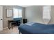 Cozy bedroom with a study desk bathed in natural light, creating an ideal workspace at 9605 E Kansas Cir # 55, Denver, CO 80247