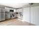 Well-lit kitchen featuring stainless steel appliances, two-tone cabinets, and bright countertops at 9605 E Kansas Cir # 55, Denver, CO 80247