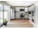 Modern kitchen equipped with stainless steel appliances, sleek white cabinetry, and bright natural light at 9605 E Kansas Cir # 55, Denver, CO 80247