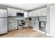 Stylish kitchen boasting stainless steel appliances, contemporary cabinets, and a sleek design at 9605 E Kansas Cir # 55, Denver, CO 80247