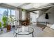 Cozy living area with a large glass table and ample natural light, creating an inviting atmosphere at 9605 E Kansas Cir # 55, Denver, CO 80247
