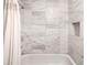 Elegant shower featuring marbled tiles and a convenient built-in niche at 9605 E Kansas Cir # 55, Denver, CO 80247