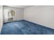 Airy bedroom featuring a window with a view and a wall-mounted air conditioner at 13890 E Marina Dr # 304, Aurora, CO 80014