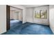Well-lit bedroom offering a large window and access to a private balcony at 13890 E Marina Dr # 304, Aurora, CO 80014