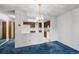Cozy dining room with a chandelier and easy access to the kitchen at 13890 E Marina Dr # 304, Aurora, CO 80014