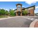 Attractive building exterior showcasing a stone tower and well-maintained landscaping, welcoming visitors and residents at 13890 E Marina Dr # 304, Aurora, CO 80014