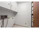 Functional laundry area offering storage cabinets and essential hook-ups for appliances at 13890 E Marina Dr # 304, Aurora, CO 80014