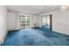 Unfurnished living room featuring a sliding glass door that leads to a balcony at 13890 E Marina Dr # 304, Aurora, CO 80014