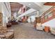 Spacious lobby with elegant staircase, comfortable seating areas, and a welcoming reception desk at 13890 E Marina Dr # 304, Aurora, CO 80014
