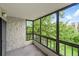 Enclosed patio featuring large windows, flooding the space with natural light and views of nature at 13890 E Marina Dr # 304, Aurora, CO 80014