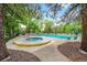 Relaxing community pool and hot tub with ample seating, surrounded by mature trees for a serene setting at 13890 E Marina Dr # 304, Aurora, CO 80014