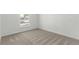 Bright bedroom with carpet flooring and a window offering views of the outdoors at 657 Locust Ave, Lochbuie, CO 80603