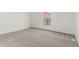 Bright room with plush carpeting and a window allowing plenty of natural light at 657 Locust Ave, Lochbuie, CO 80603