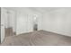 Spacious carpeted bedroom features dual closets and attached bathroom at 657 Locust Ave, Lochbuie, CO 80603