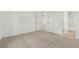 Large room with plush carpet, ensuite bathroom, and overhead ceiling fan at 657 Locust Ave, Lochbuie, CO 80603