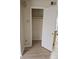 Walk in closet off of kitchen with rod for hangers and additional storage at 1845 N Kendall St # 316D, Lakewood, CO 80214