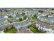 Aerial view of a beautifully designed townhome community with lush green spaces and tree-lined streets at 19804 Summerset Ln, Parker, CO 80138