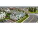 Aerial view of community with colorful townhomes, sidewalks and ample parking at 19804 Summerset Ln, Parker, CO 80138